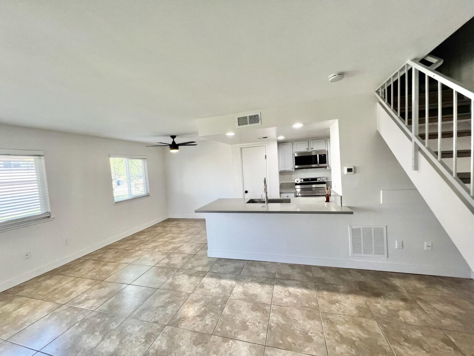 72671 Eagle Road, Unit 3 Palm Desert, CA 92260 - Photo 13 of 25 a view of kitchen with kitchen island microwave and stove