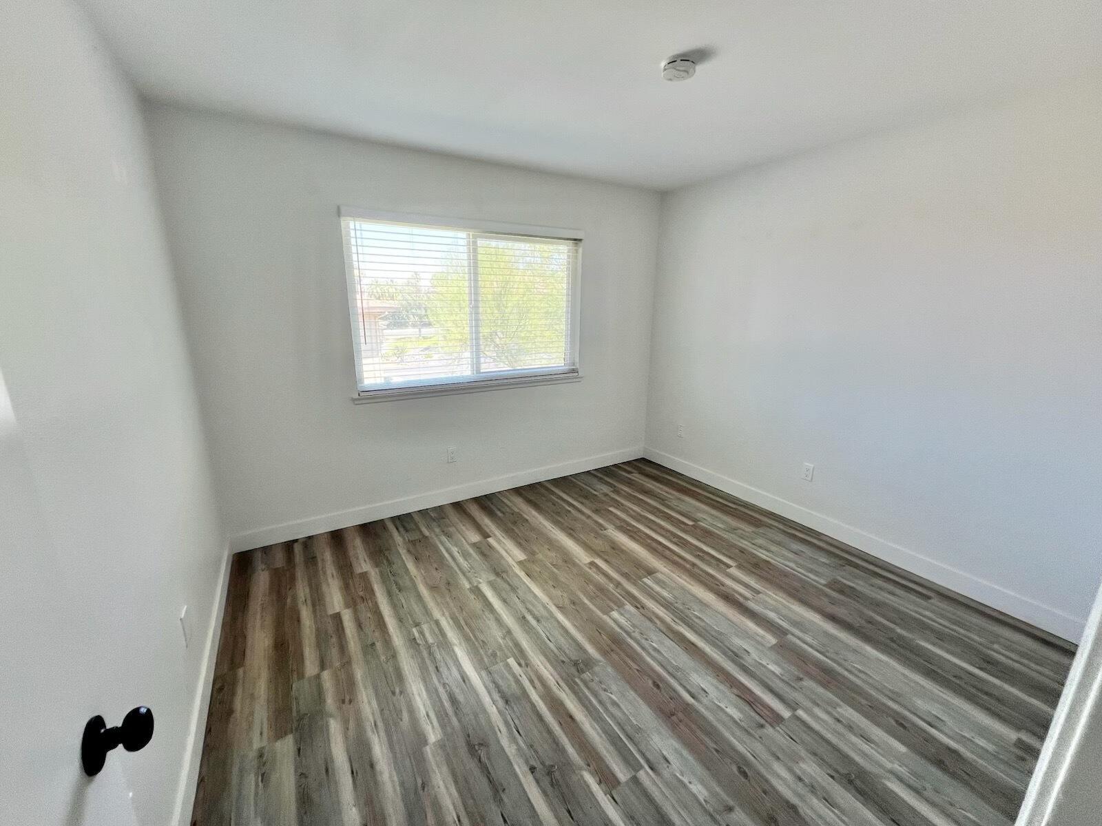 72671 Eagle Road, Unit 3 Palm Desert, CA 92260 - Photo 17 of 25 a view of a room with wooden floor and window
