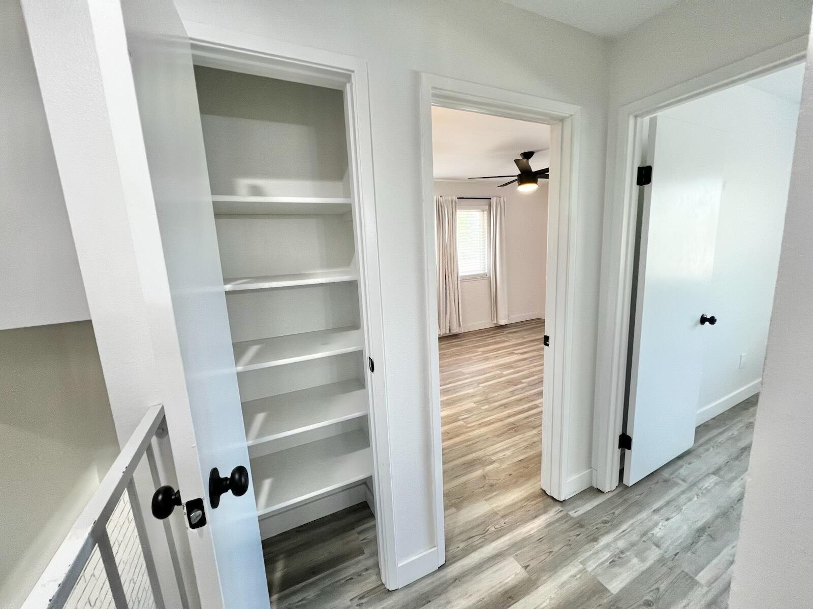 72671 Eagle Road, Unit 3 Palm Desert, CA 92260 - Photo 20 of 25 a view of a hallway with wooden floor and closet