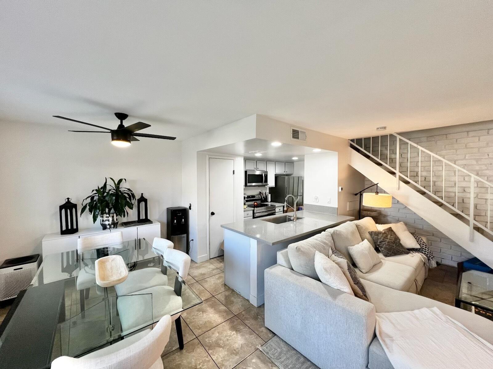 72671 Eagle Road, Unit 3 Palm Desert, CA 92260 - Photo 2 of 25 a living room with furniture and a flat screen tv
