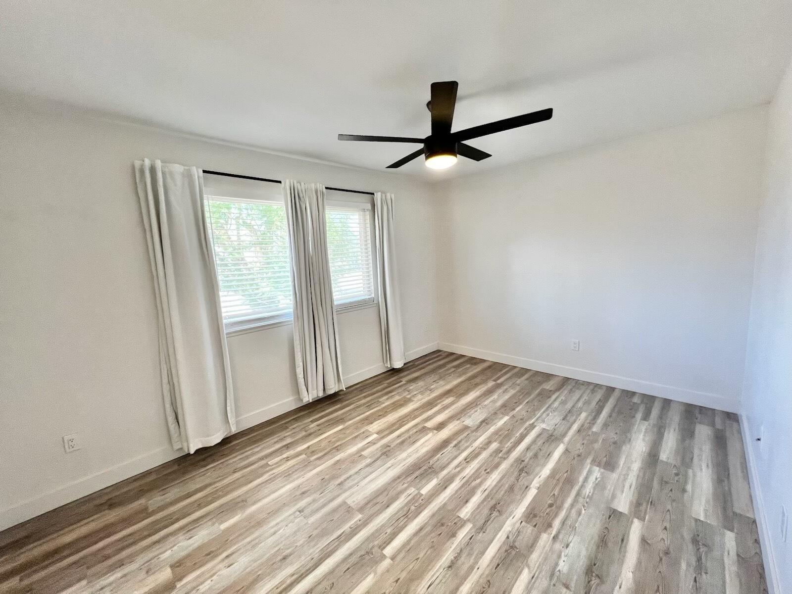 72671 Eagle Road, Unit 3 Palm Desert, CA 92260 - Photo 21 of 25 wooden floor in an empty room with a window
