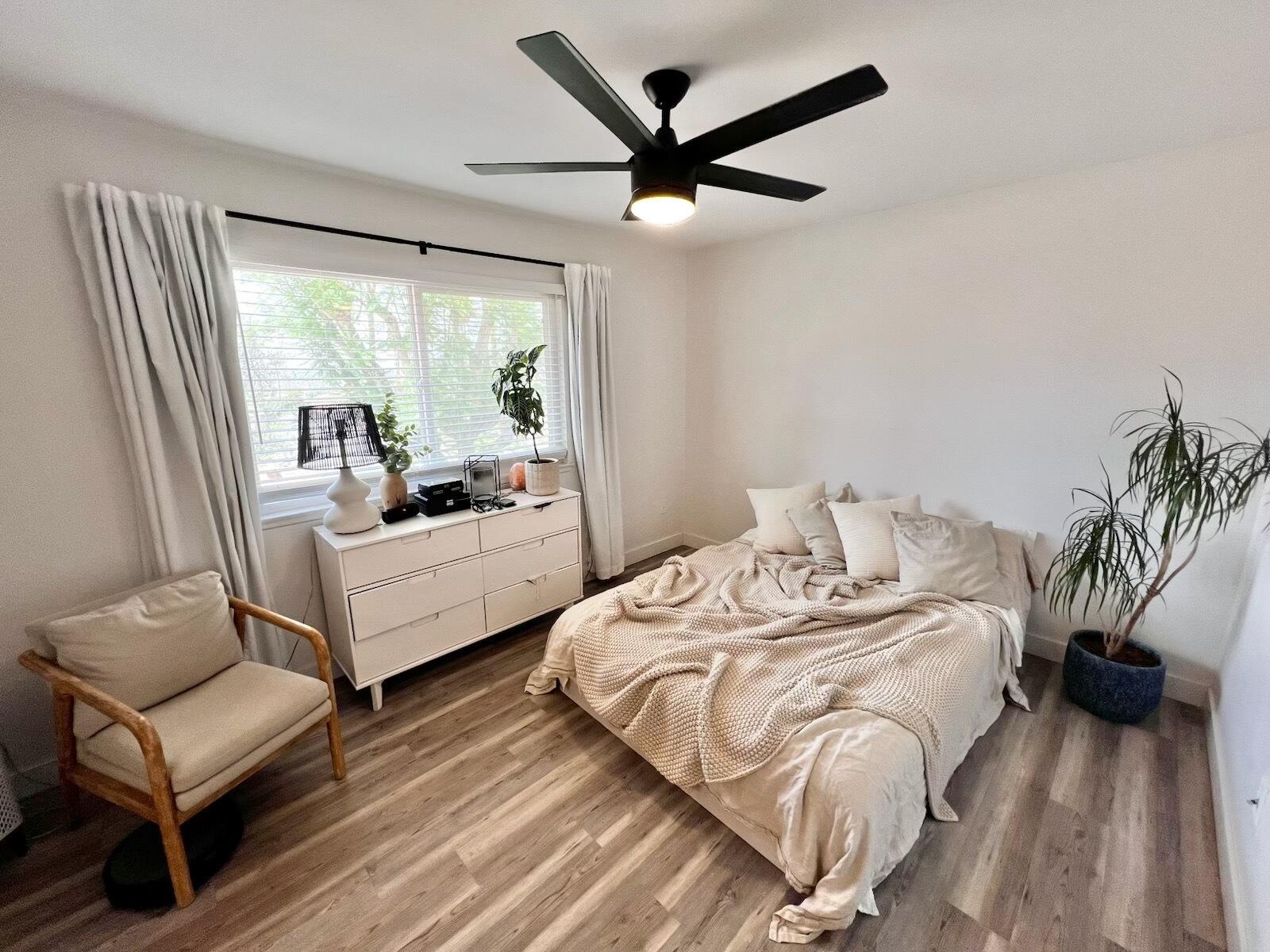 72671 Eagle Road, Unit 3 Palm Desert, CA 92260 - Photo 23 of 25 a bedroom with a bed and a large window