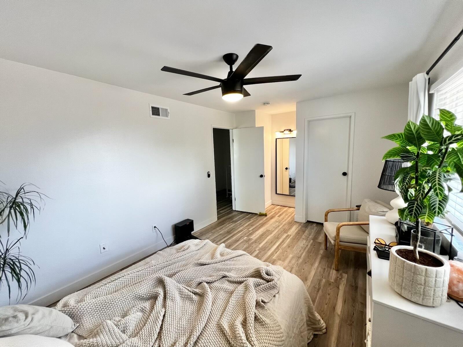 72671 Eagle Road, Unit 3 Palm Desert, CA 92260 - Photo 24 of 25 a bedroom with a bed and a potted plant