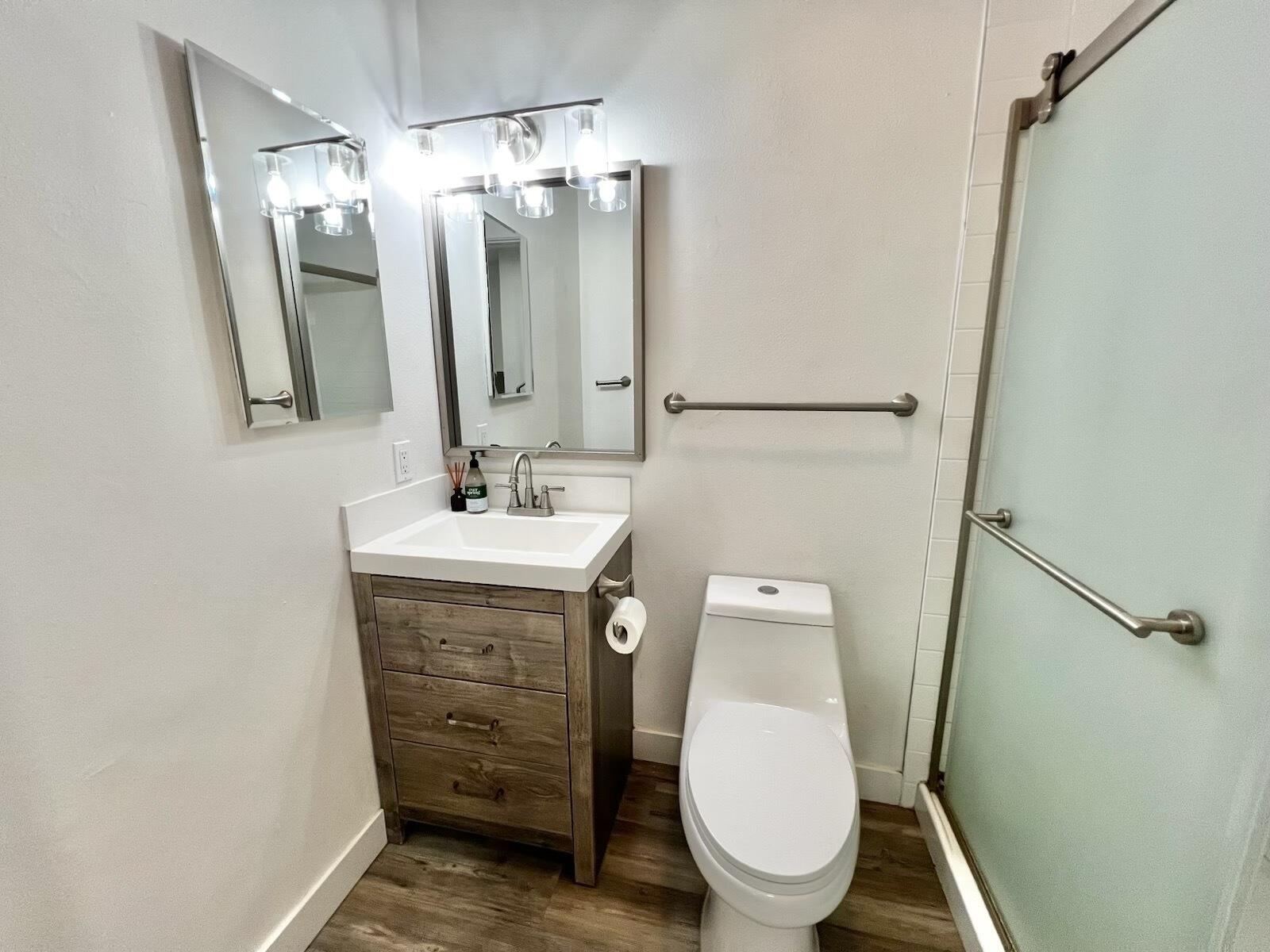72671 Eagle Road, Unit 3 Palm Desert, CA 92260 - Photo 25 of 25 a bathroom with a toilet a sink and mirror