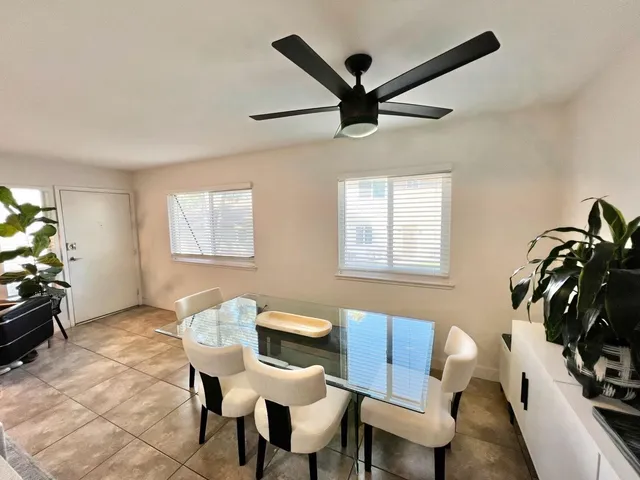 a view of a livingroom with furniture and a window