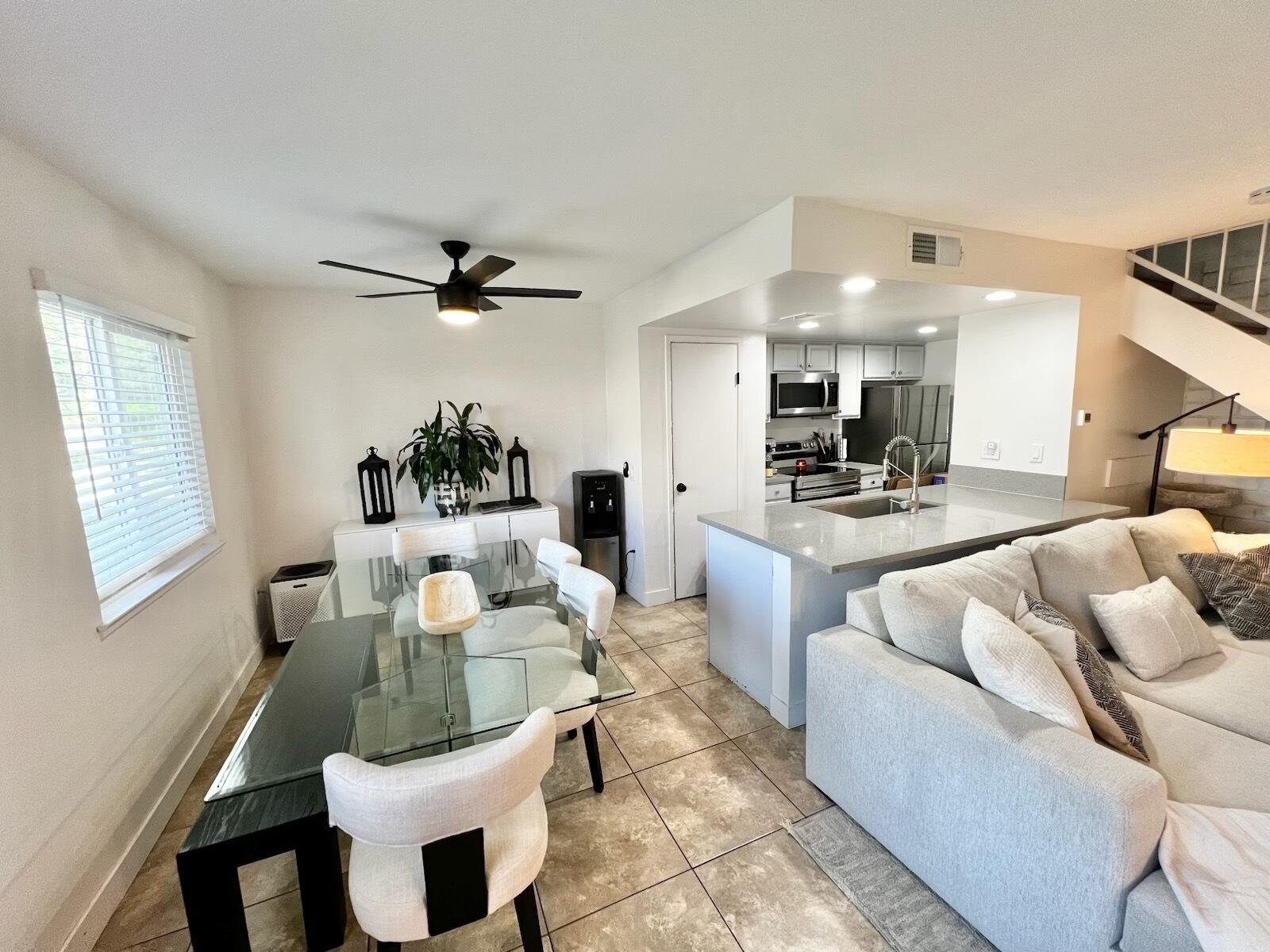 72671 Eagle Road, Unit 3 Palm Desert, CA 92260 - Photo 5 of 25 a living room with furniture and a window