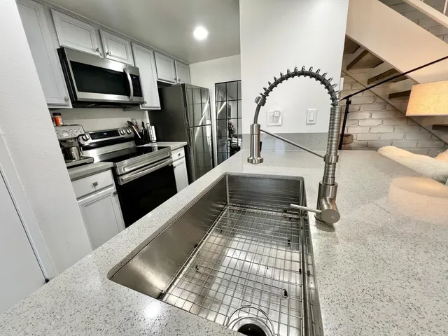 a kitchen with a stove and a microwave