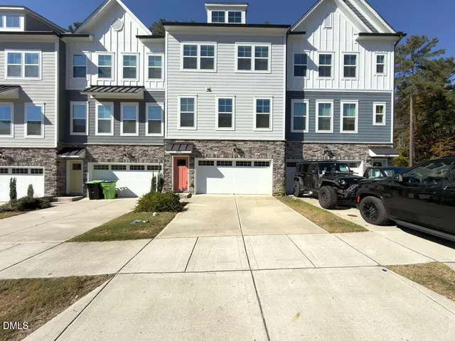 a front view of a building with traffic signal lights