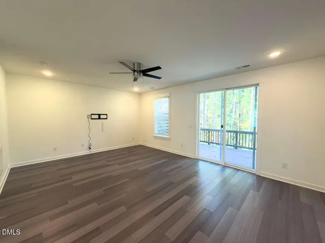 a view of balcony with wooden floor and trees