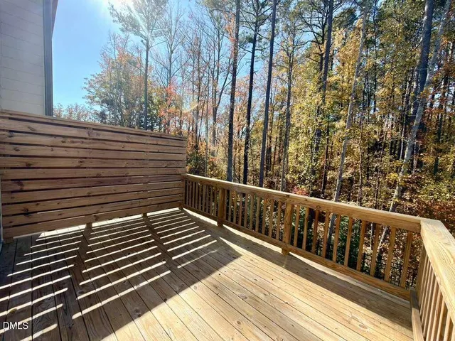 a front view of a house with large windows