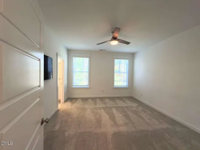 a bathroom with a shower and a toilet