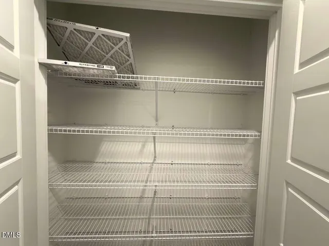 a view of hallway with livingroom