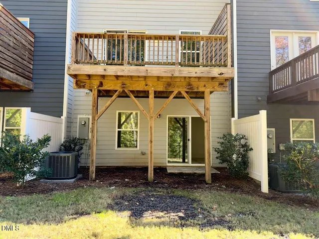 an aerial view of a house with a big yard