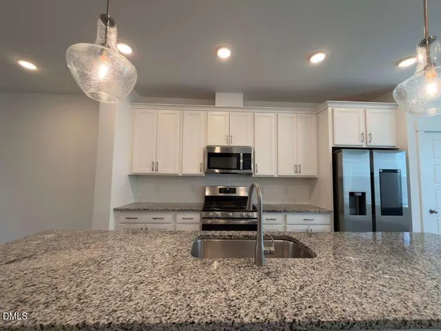 a view of a kitchen with a sink wooden floor and kitchen