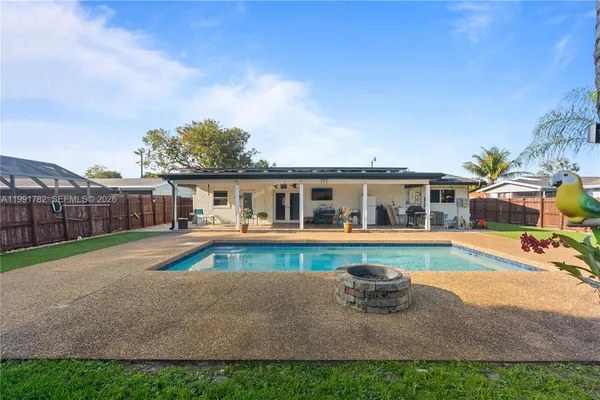 swimming pool view with outdoor seating