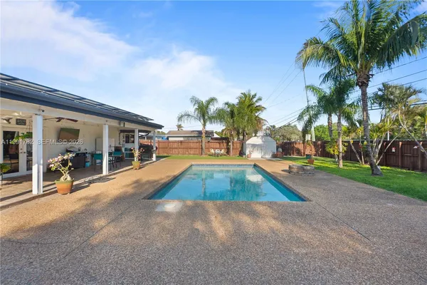 a view of outdoor space with swimming pool and lounge chair