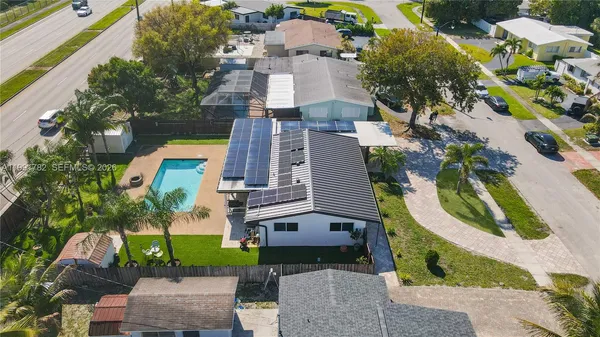an aerial view of a house with outdoor space