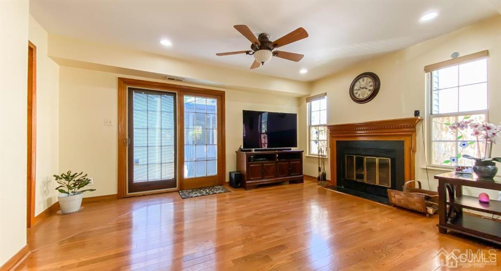 0 Lavender Drive Edison, NJ 08820 - Photo 13 of 36 a living room with furniture a fireplace and a flat screen tv