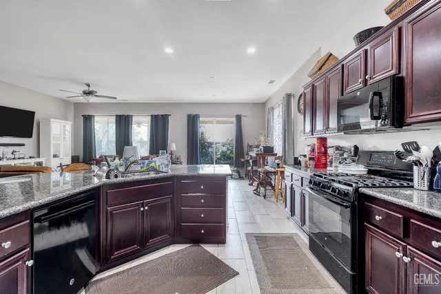 a kitchen with lots of counter top space and stainless steel appliances