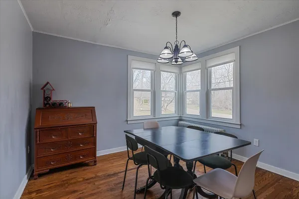 a view of a dining room with furniture and window