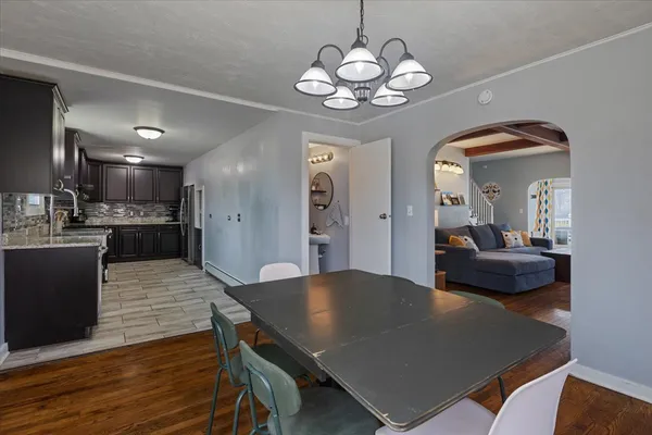 a view of a dining room with furniture and wooden floor