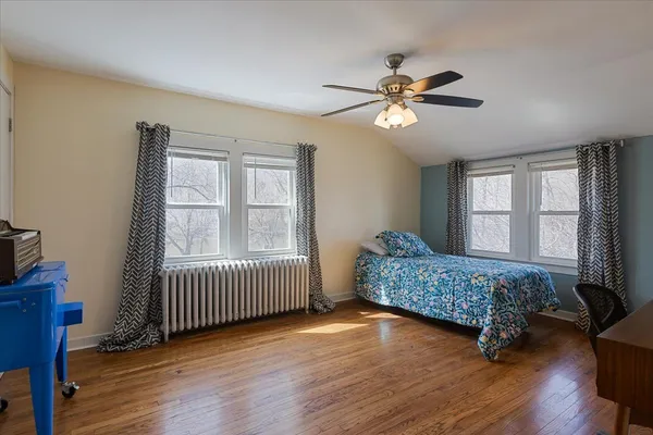 a living room with a bed furniture and a window