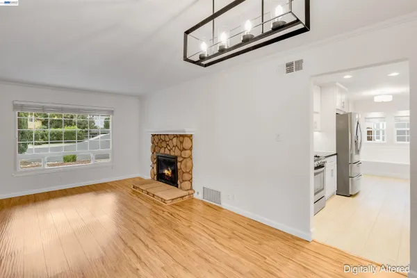 a view of a livingroom with wooden floor and a window