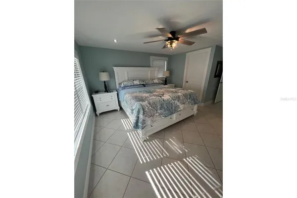 a bathroom with a bathtub and a flat screen tv