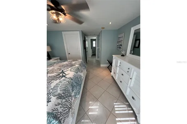 a bathroom with a granite countertop sink and a toilet