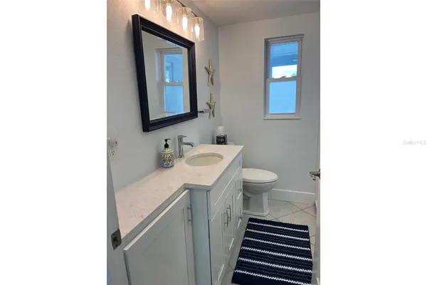 a view of a storage & utility room with a sink