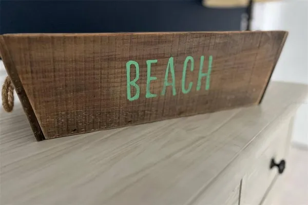 a patio with a table and chairs under an umbrella