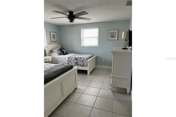 a view of backyard with outdoor seating and trees