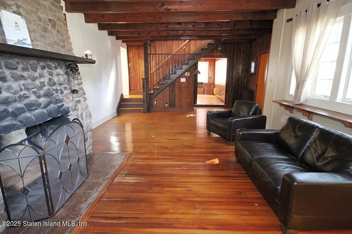 443 Edinboro Road Staten Island, NY 10306 - Photo 12 of 33 a living room with furniture and a fireplace