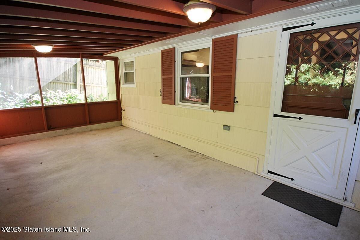 443 Edinboro Road Staten Island, NY 10306 - Photo 31 of 33 a view of an empty room with a window