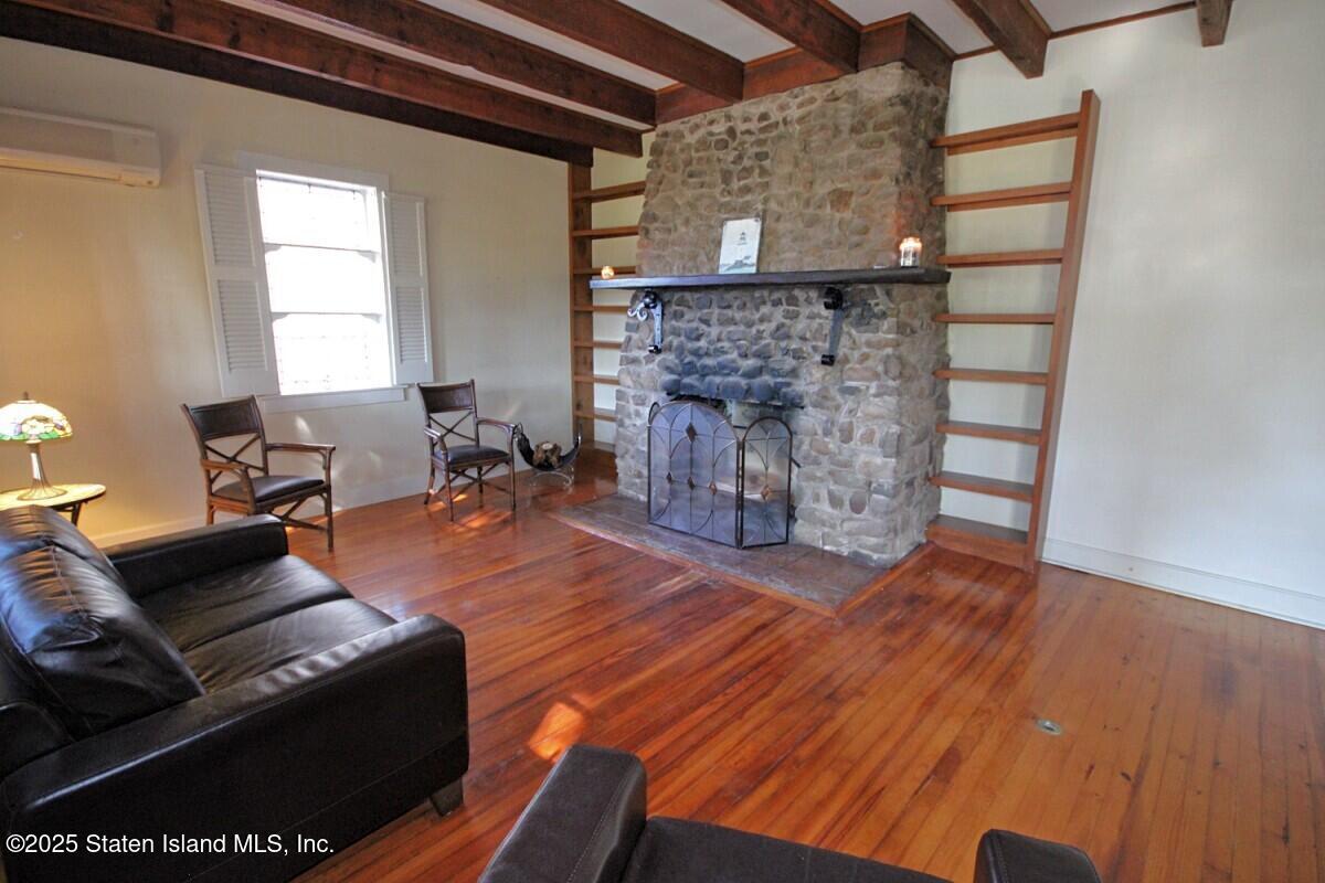 443 Edinboro Road Staten Island, NY 10306 - Photo 9 of 33 a living room with furniture and a fireplace