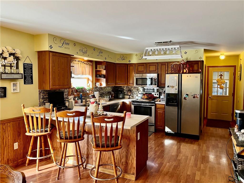 100 Perrine Road Grove City, PA 16127 - Photo 7 of 24 a kitchen with a table chairs refrigerator and cabinets