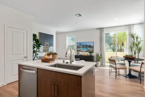 a view of a house with swimming pool and sitting area