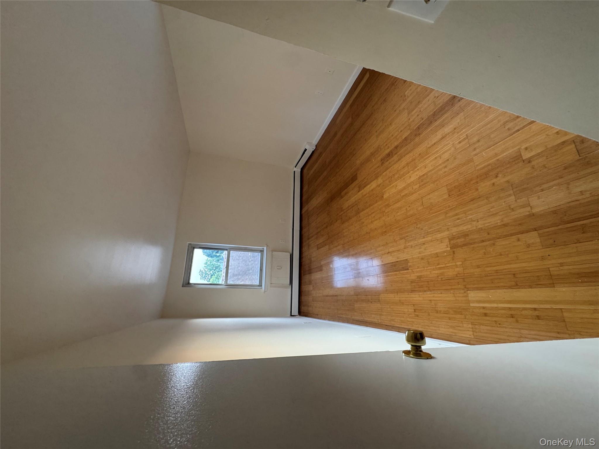 199 Hoover Road, Unit 2F Yonkers, NY 10710 - Photo 5 of 16 Spare room with light wood-type flooring and baseboards