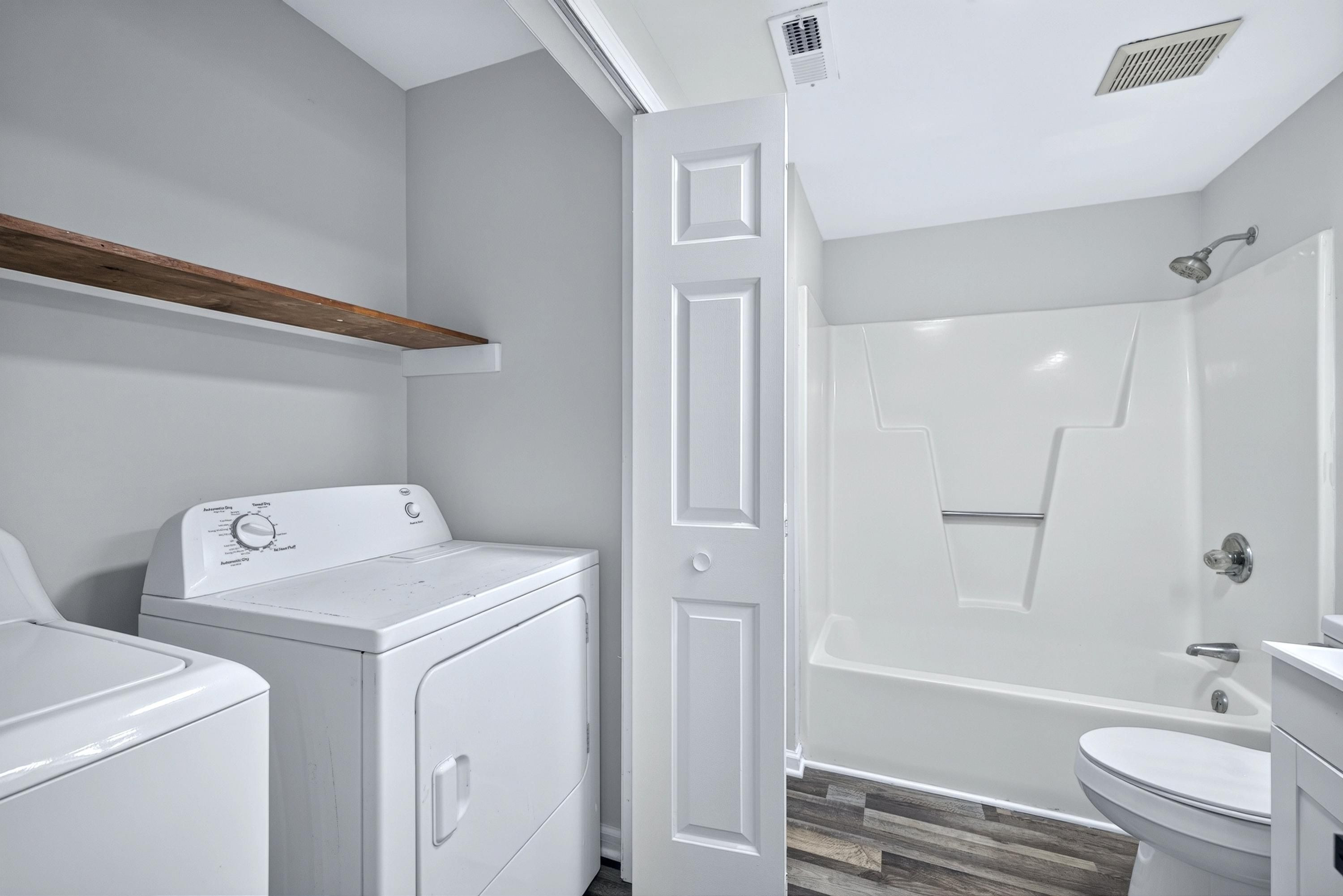 708 Powell Drive, Unit A Raleigh, NC 27606 - Photo 24 of 56 Main level guest bath and laundry