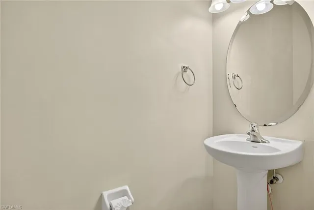 a bathroom with a sink and mirror