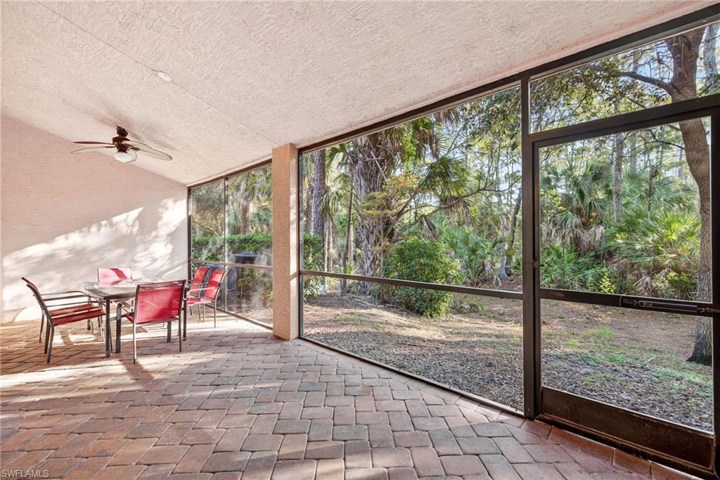 7666 Bristol Circle Naples, FL 34120 - Photo 17 of 19 a view of a porch with wooden floor and outdoor space