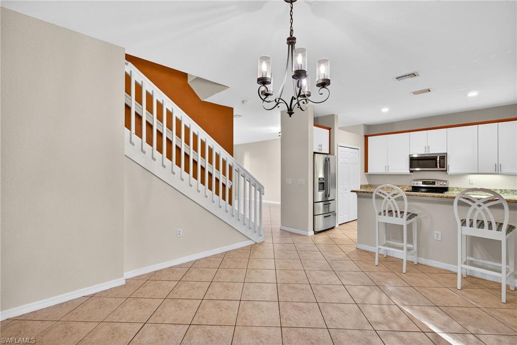 7666 Bristol Circle Naples, FL 34120 - Photo 4 of 19 a view of a kitchen with electric appliances