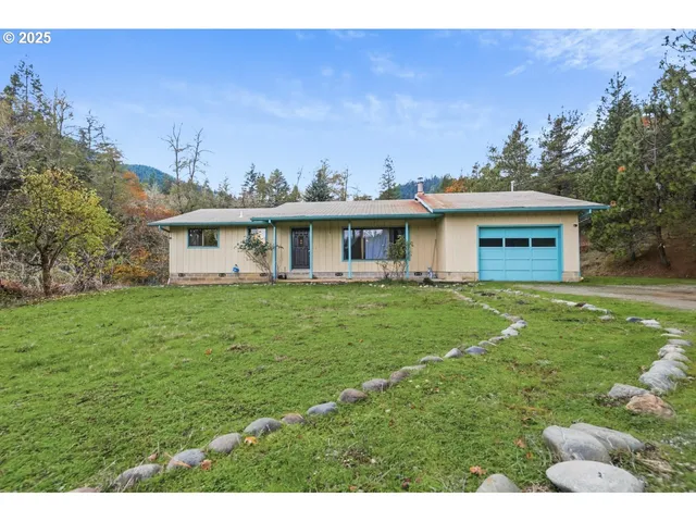 a front view of house with yard and green space