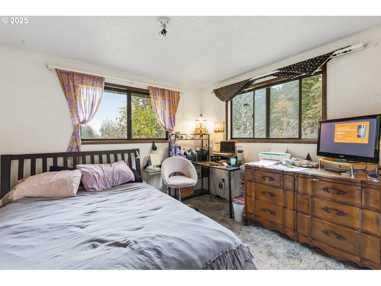 2100 Boyer Road Riddle, OR 97469 - Photo 11 of 33 a bedroom with a bed and large windows