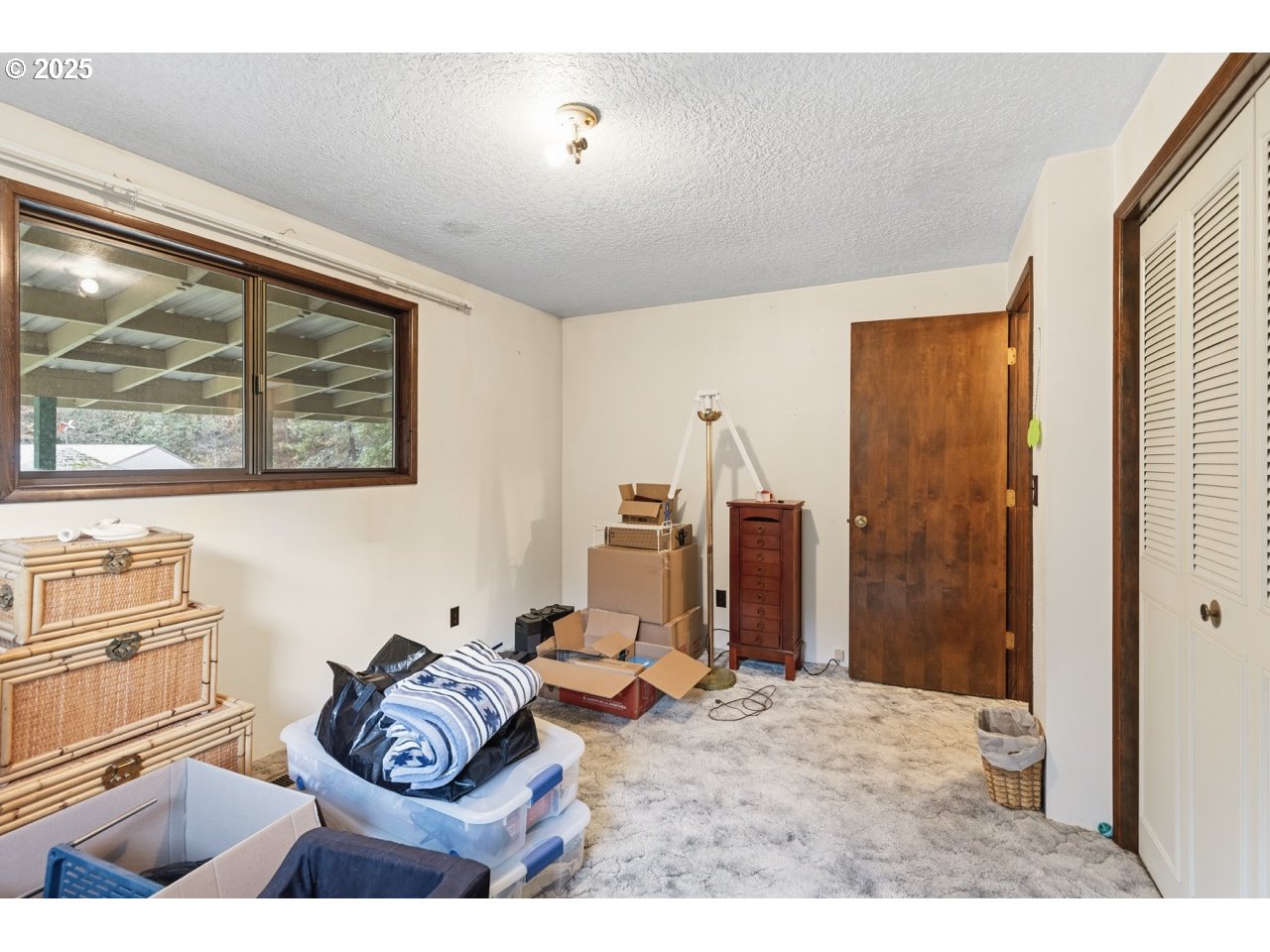 2100 Boyer Road Riddle, OR 97469 - Photo 16 of 33 a bedroom with furniture and a window