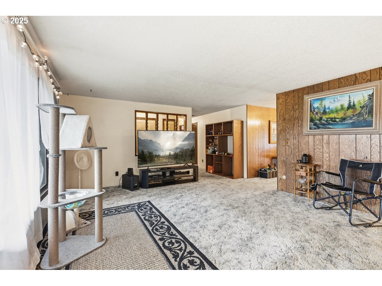 2100 Boyer Road Riddle, OR 97469 - Photo 3 of 33 a living room with furniture and a flat screen tv
