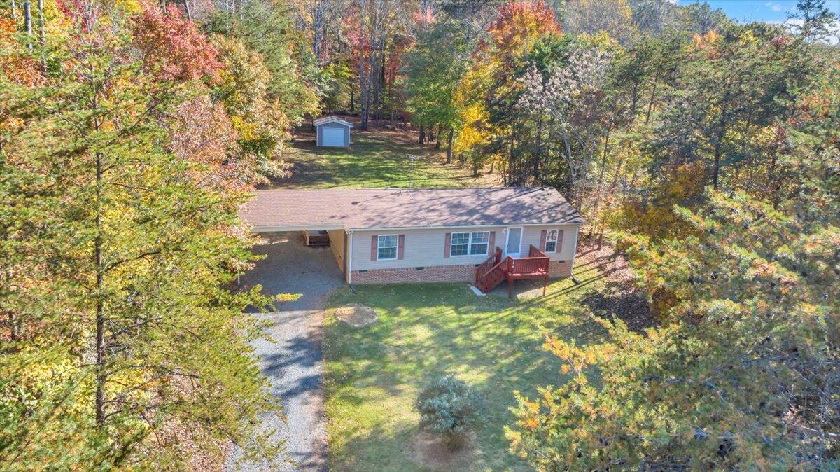 240 Highland Lake Road Union Hall, VA 24176 - Photo 3 of 56 a view of a house with a yard