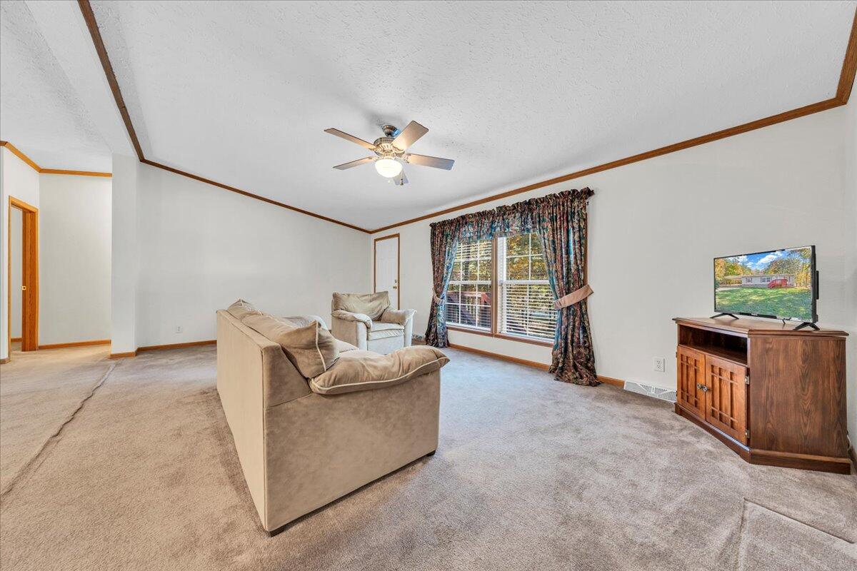 240 Highland Lake Road Union Hall, VA 24176 - Photo 4 of 56 a living room with furniture and wooden floor