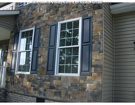 Exterior Front. Stone