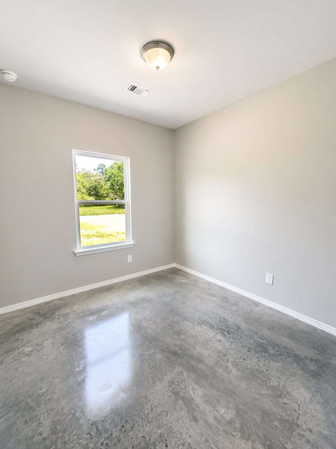 6 Greenway Drive Trinity, TX 75862 - Photo 23 of 27 an empty room with windows